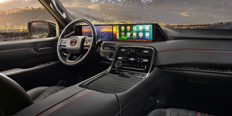 Angled view of the front seats and Monolith Display in the 2026 Nissan Armada