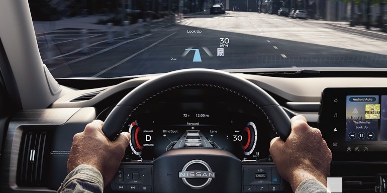 2026 Nissan Pathfinder Head-Up Display projecting directions, speed, and music info onto the windshield.